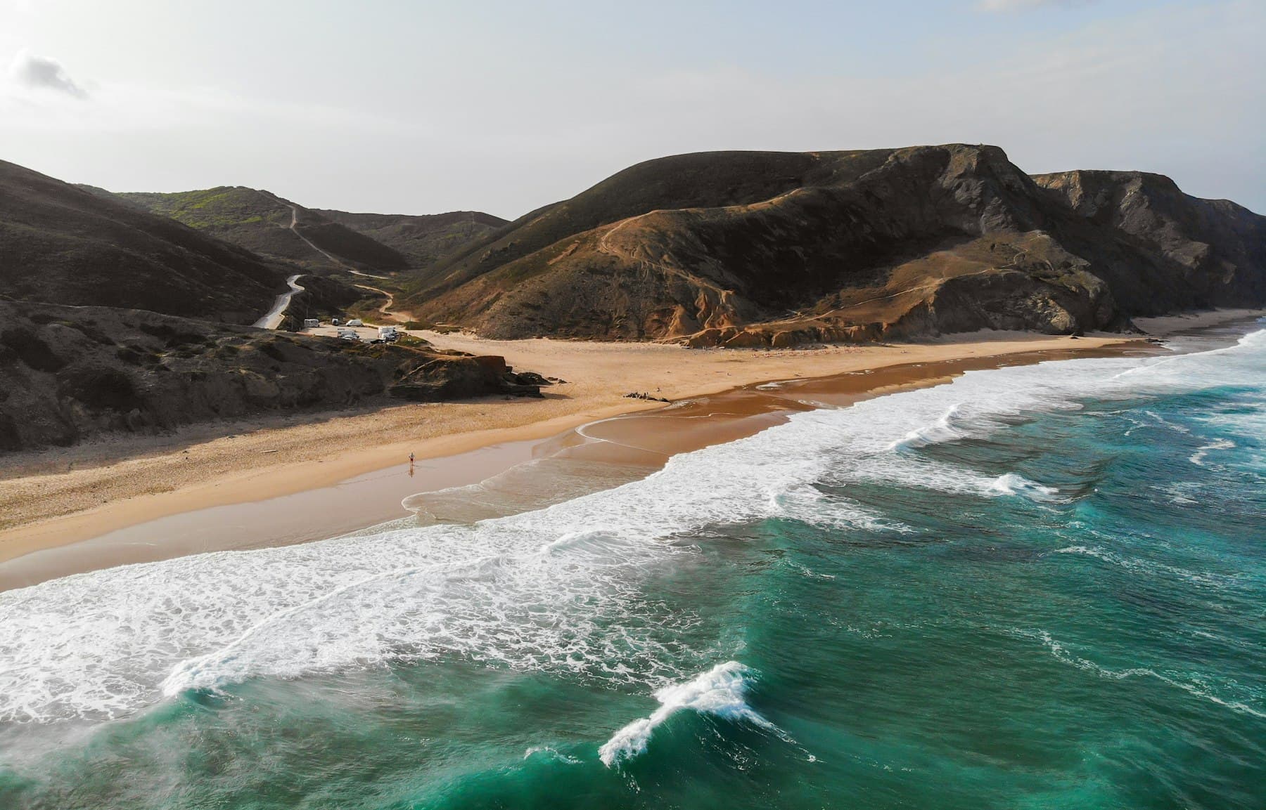 A turquoise Atlantic cove on the Portuguese coast seen from above