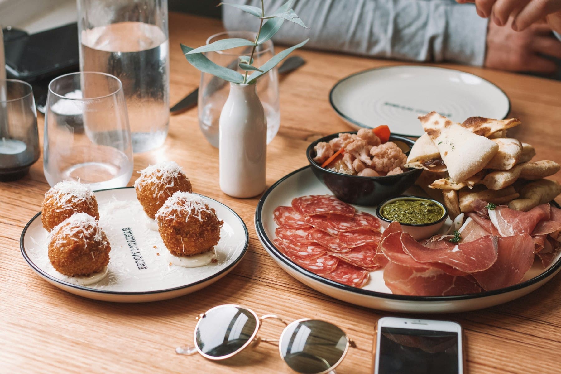 A table of croquetas, jamón and cold drinks in the Spanish sun
